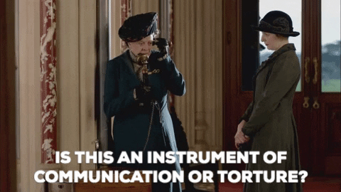 A gif of a Downton Abbey character using a phone