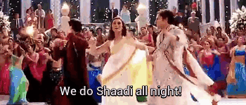 Attribution: [Image description: People dressed in traditional South Asian dress are dancing and singing 'We do Shaadi all night!'] Via Giphy