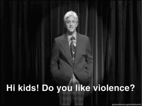 Voditelj v črnobeli oddaji nagovori občinstvo: Zdravo otroci! Imate radi nasilje? 