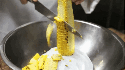 Cutting corn off of the cob