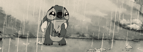 Stitch, from the animated movie Lilo and Stitch, cries in the rain.