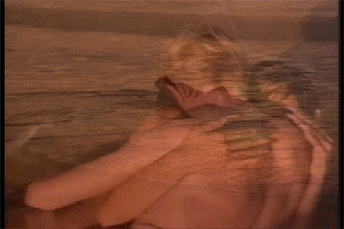 David Bowie and a woman getting caught enjoying beach sex