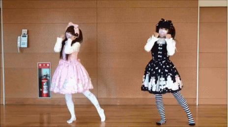 Two-Lolita-Girls(one pink and one black)-Dancing-While-Wearing-Face-Masks