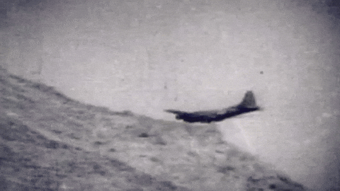 black and white gif of plane crashing into hill