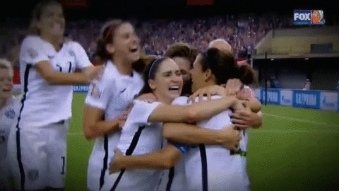 Womens soccer team hugging