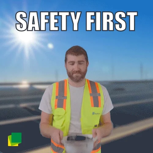 Man in safety vest pointing with text Safety First