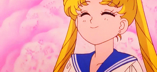 A gif of Sailor Moon smiling.