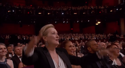 Meryl Streep applauding and pointing
