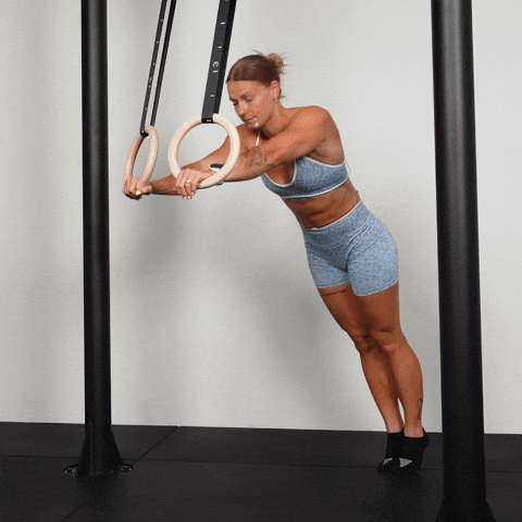 Malin performing a ring triceps extension demonstration