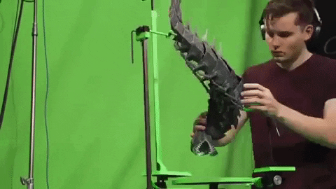 a time-lapse of a stop motion artist animating a creature flying