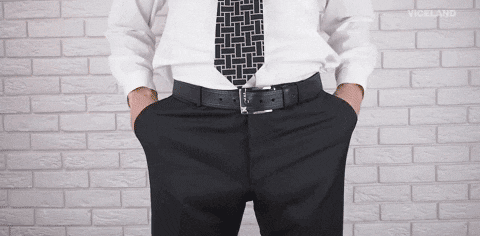 A man showing empty pockets GIF
