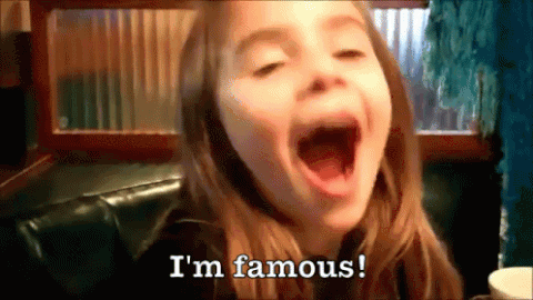 Girl saying 'I am famous'
