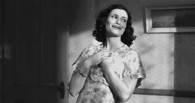 woman comically fainting in mocking manner