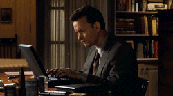 Gif of a scene from the movie "You've got mail" showing Tom Hanks typing on his laptop and getting nervous