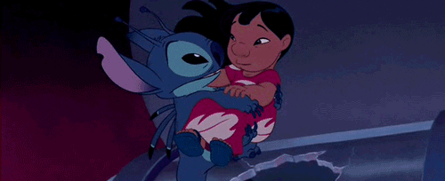 Lilo giving Stitch a hug and kiss on the nose