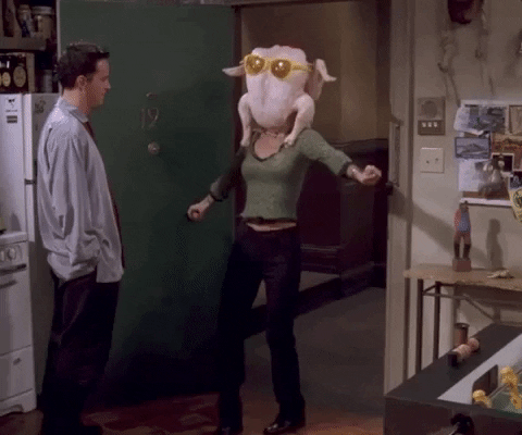 GIF from the TV show 'Friends' where Rachel has a turkey on her head