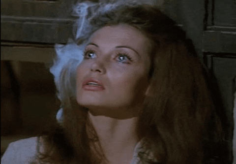 Animated gif from the movie Westworld, woman robot with smoking head
