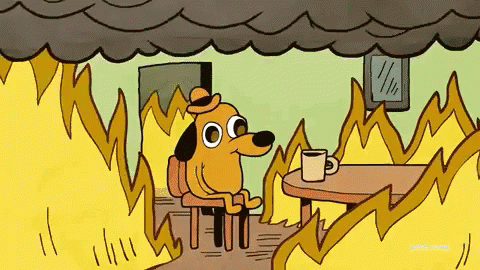 An animated version of the This is Fine meme featuring a dog wearing a hat in a burning room.
