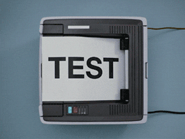 A gif showing printer constantly printing papers with word "test" on them.
