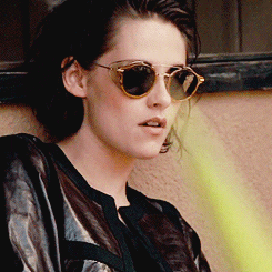 Kristen Stewart wearing sunglasses and a leather jacket