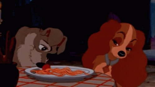 Lady and the Tramp - Tramp pushing a meatball to Lady with his cute li'l doggy nose :)