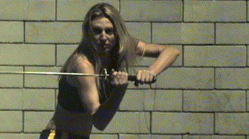 woman fighting martial arts slow motion sword