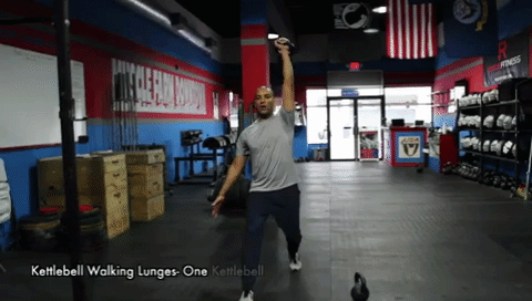 Walking Lunges With One Kettlebell Overhead