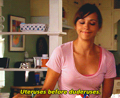 Parks and Recreation's Ann Perkins sits down while Leslie Knope says, "uteruses before duderuses."