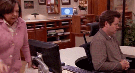 GIF of someone trying to talk to Ron Swanson on Parks & Recreation and him swiveling away from them.