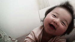 cute happy baby smiling falling