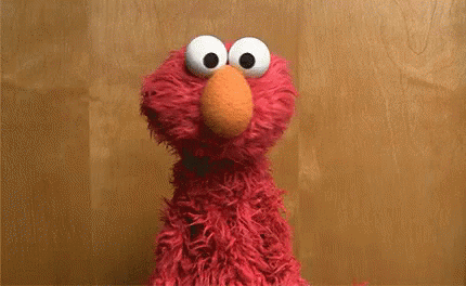 A gif of the muppet Elmo shrugging with the text 