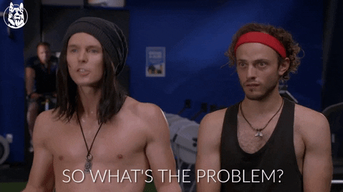 Two men standing next to each other (one shirtless) with one saying 'So what's the problem?'