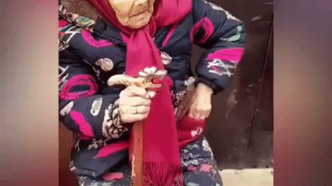 107 years old mama giving her 84 years old daughter some candy