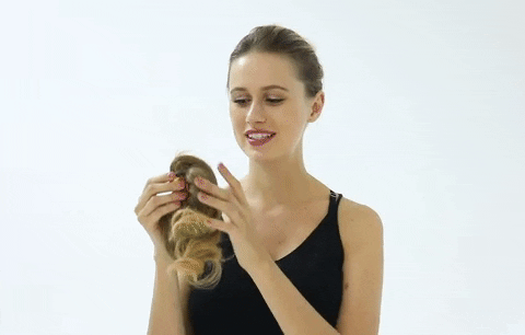 lady instructing on tying a hair extension bun
