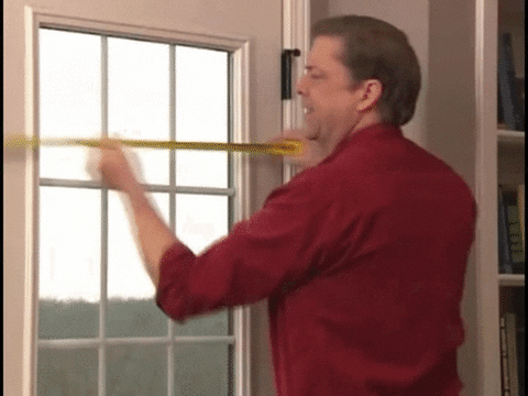 Gif: Man getting tangled up in a measuring tape