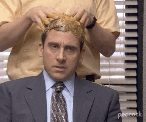 a GIF of Michael Scott getting a peanut butter scalp massage by Dwight