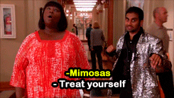 Gif of a man and woman saying "Mimosas" "treat yourself"