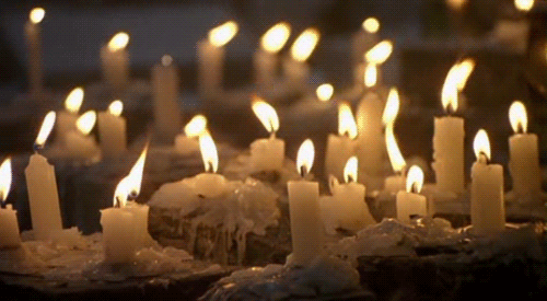 An animated gif showing a hundred burning candles.