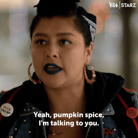 GIF of woman with gold hoop earrings and blue lipstick saying "yeah, pumpkin spice, I'm talking to you."