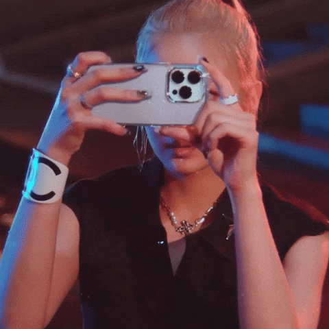 Person taking a photo of food with their phone before eating