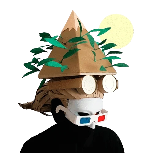 Figure wearing a cardboard mountain with paper leaves as a hat, and 3D glasses