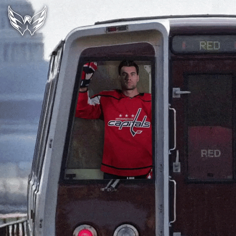 GIF of man ifrom Washington Capitals on a tram saying "All Aboard"