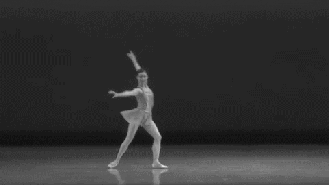 A GIF in black and white of a ballerina twirling