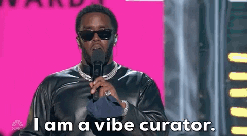 Giphy clip of someone saying "I am a vibe curator" into a microphone.