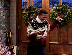 GIF of Carlton (Alfonso Ribeiro) doing the Carlton dance in a Christmas sweater