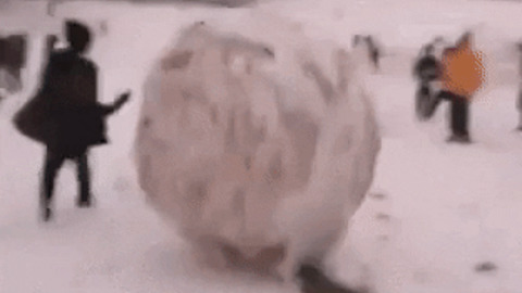 Playing with a giant snow ball