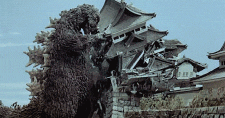 A GIF of Godzilla destroying a Japanese castle.