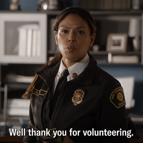 policewoman thanking people for volunteering
