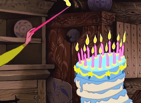 lighting candles on a cake animated gif