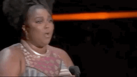 GIF at award ceremony, Lizzo saying "Let's Go!"